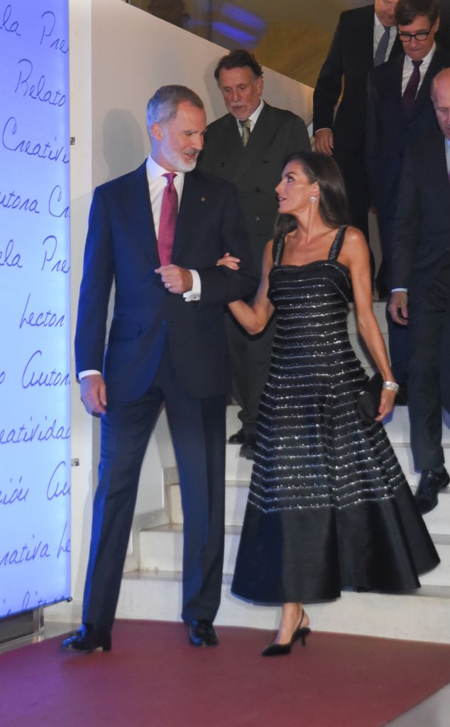 Queen Letizia descends steps with Felipe