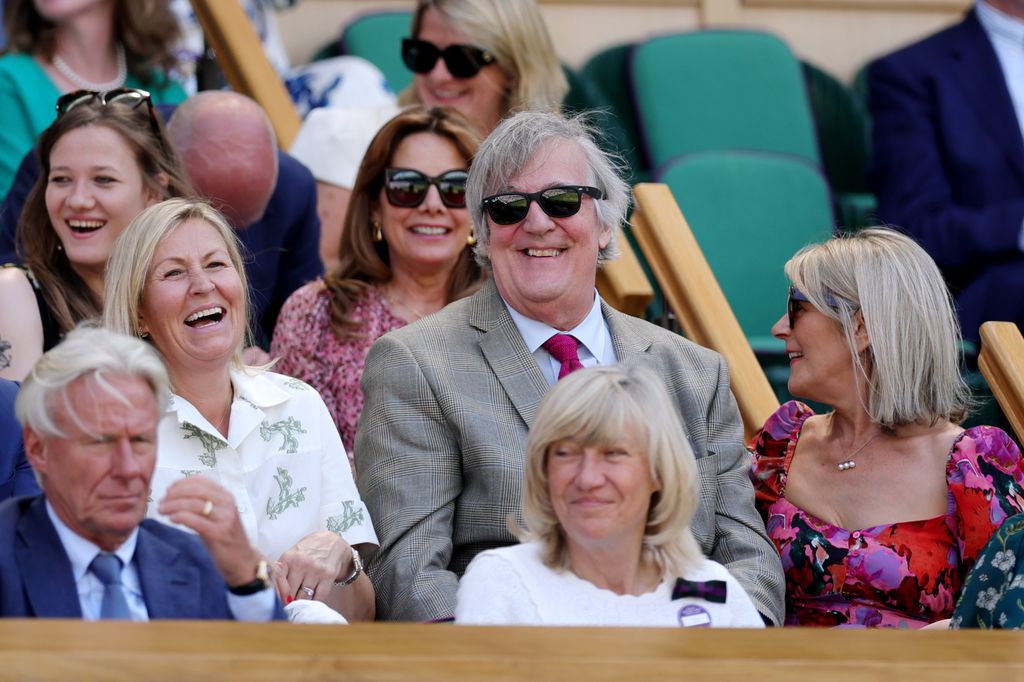 Stephen Fry smiles in the Royal Box prior to the Ladies' Singles