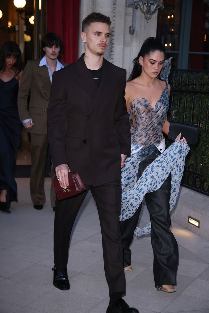 Romeo Beckham and Kim Turnbull leaving their hotel to head to the Victoria Beckham show during the Womenswear Fall/Winter 2025/2026 as part of Paris Fashion Week on March 07, 2025 in Paris, France.