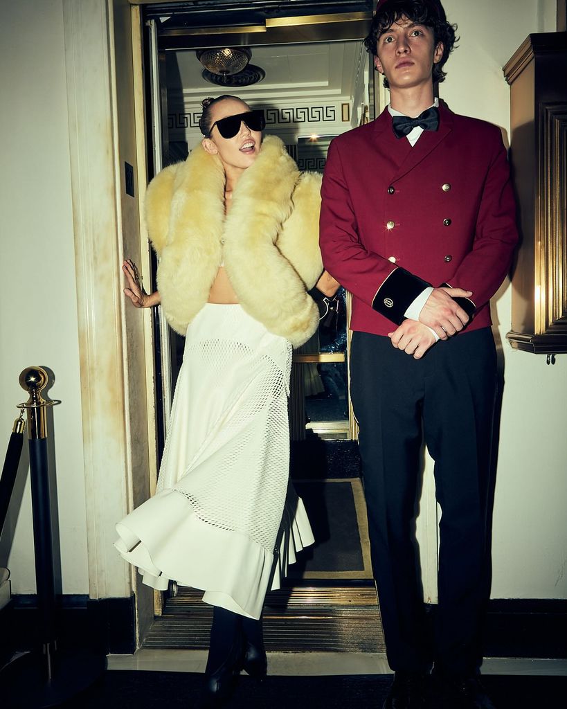 Miley Cyrus poses in a fluffy vest, maxi skirt and sunglasses to attend a Met Gala afterparty 