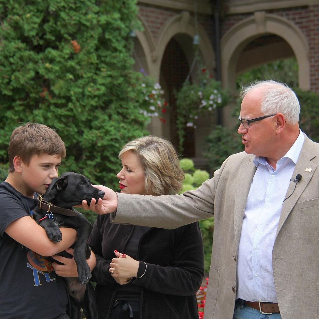 Gus Walz, Gwen Walz and Tim Walz with their dog Scout 