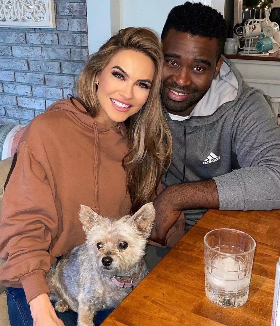 Chrishell Stause and Keo Motsepe posing with dog for selfie