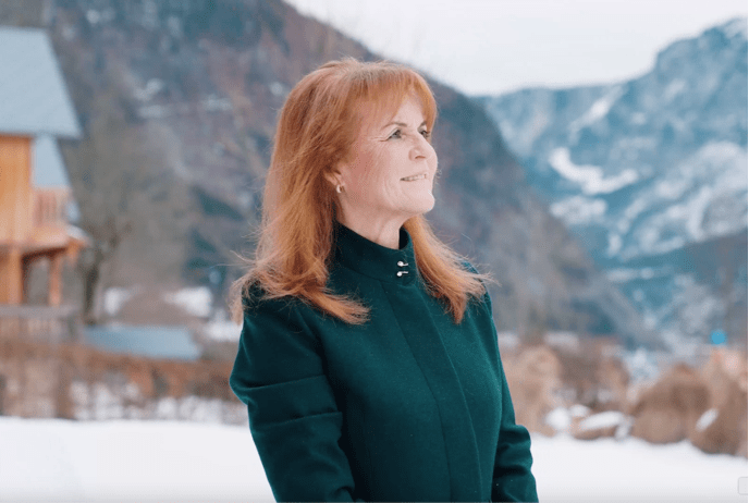 Sarah Ferguson at Mayrlife im a green coat gazing into the snow