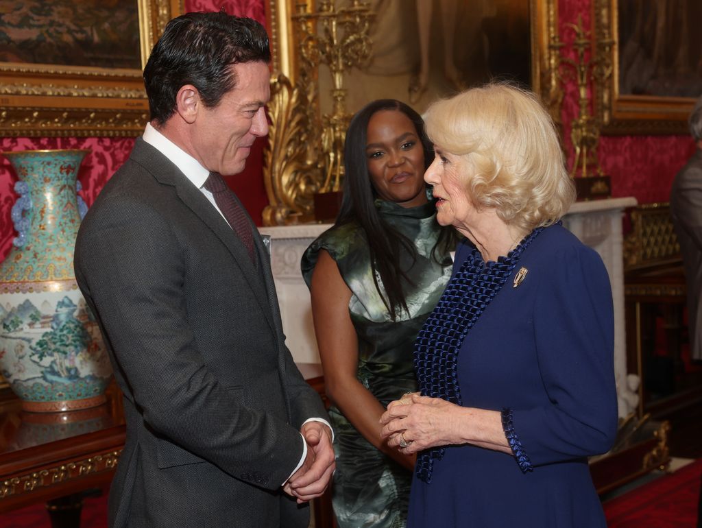 Queen Camilla speaking with Luke Evans with Oti Mabuse in the background