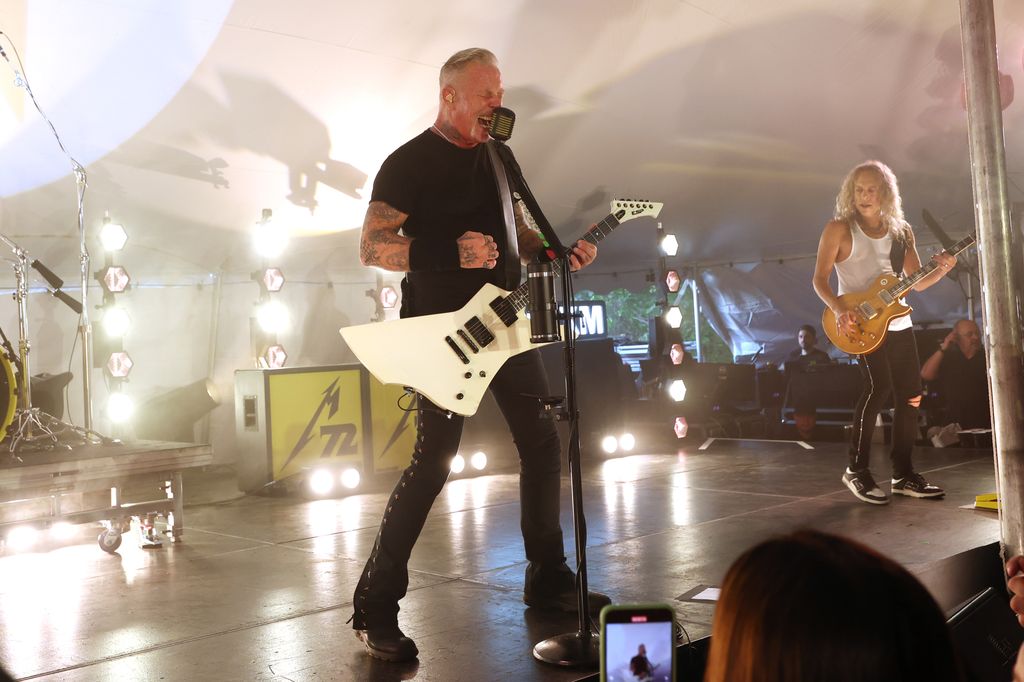 metallica frontman james hetfield on stage with guitar