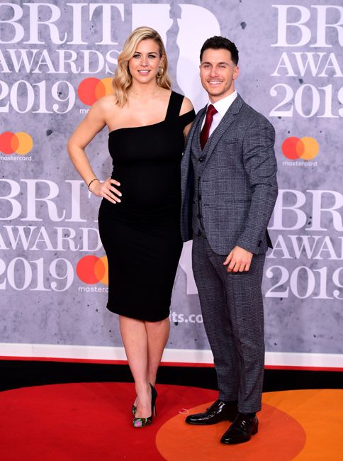 pregnant gemma and gorka pose on a red carpet looking glam