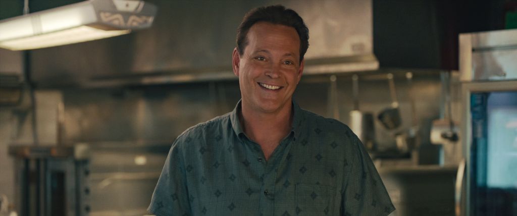 close-up of man smiling in kitchen
