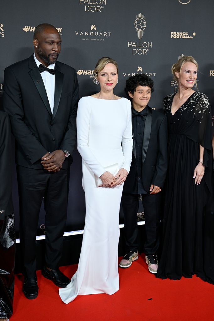 French former basketball player Florent Pietrus and Princess Charlene on the red carpet with two others