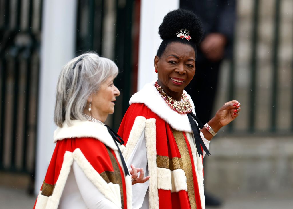 Baroness Dame Floella Benjamin (R), selected to carry the Sovereign's sceptre with dove, which represents spirituality, equity and mercy arrives at Westminster Abbey 