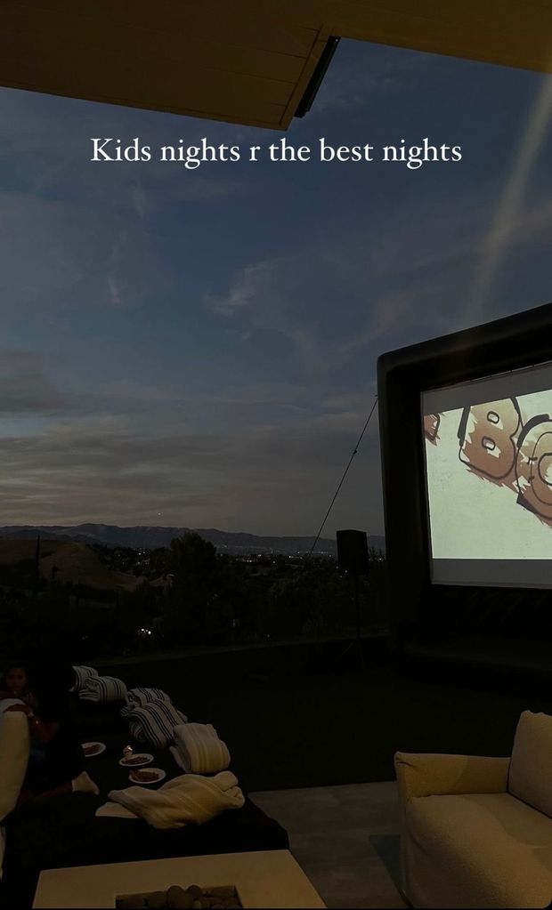 dark sky with cinema in front of it 