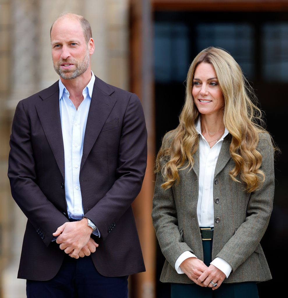 Prince William and Catherine, Princess of Wales side by side in blazers