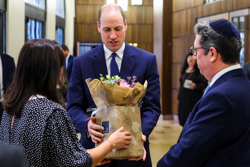 William receives flowers for wife Kate at Western Marble Arch Synagogue