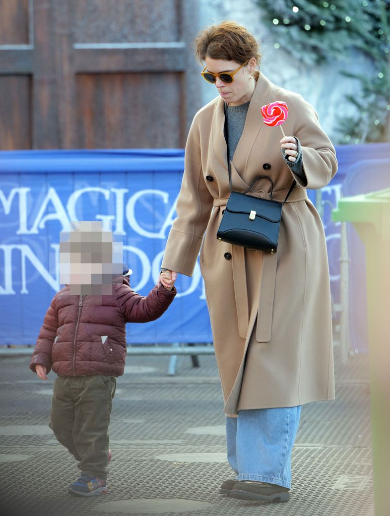 Princess Eugenie takes the family to Hyde parks Winter Wonderland for a fun day on the rides. Eugenie  pulls some funny faces as her friend films her on the childrenâs rides , then treats them to some hot dogs n pizza, followed off by some sweet treats .
Please take advice as to pixelating the childs face prior to publication.