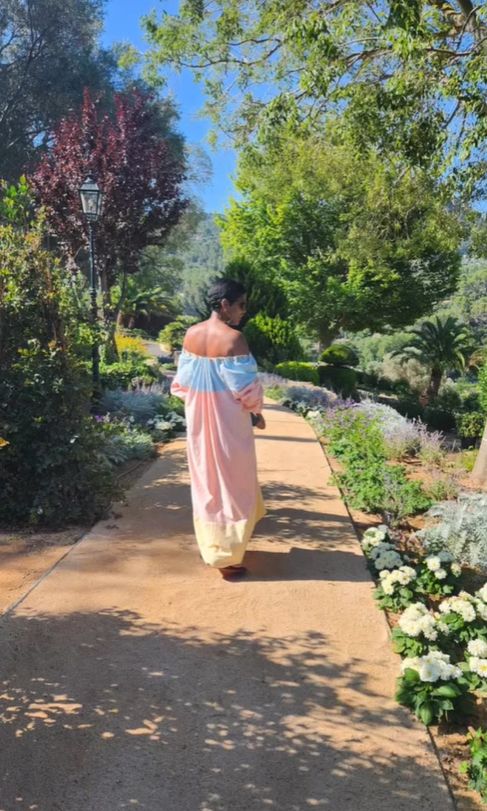 Tamron Hall walking through a park