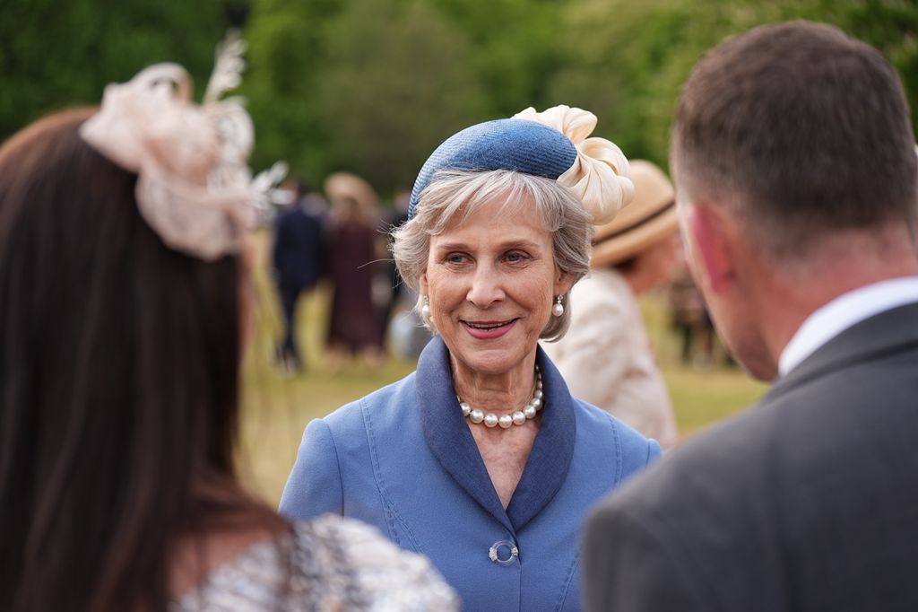 Birgittte, Duchess of Gloucester wearing blue coat and hat at garden party
