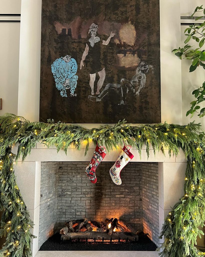 fireplace with garland and artwork