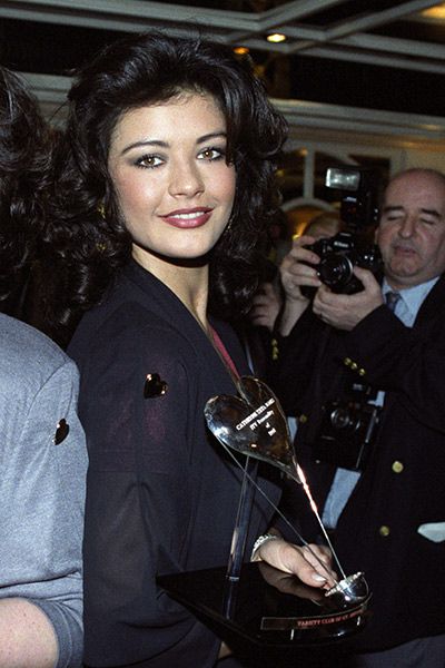 Catherine Zeta Jones with her award after the cast of The Darling Buds of May were named ITV Personality of 1991 