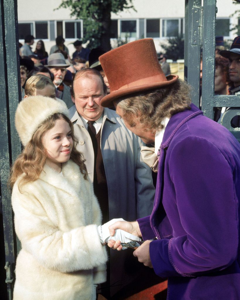 Julie Dawn Cole as Veruca Salt shaking Gene Wilder's hand