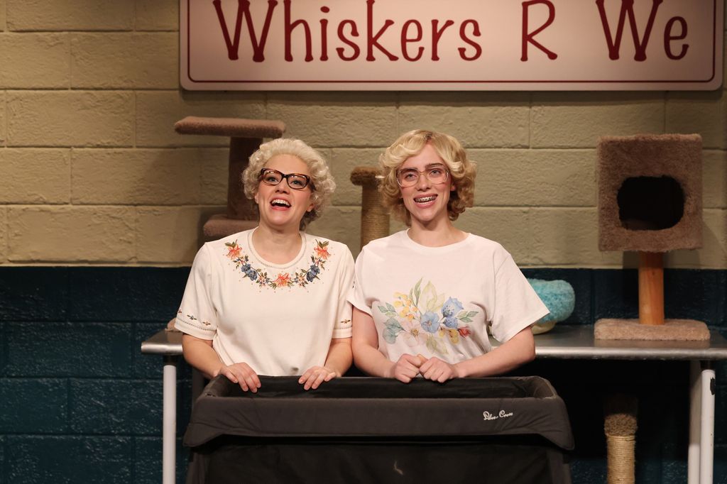 SATURDAY NIGHT LIVE -- "Kate McKinnon, Billie Eilish" Episode 1852 -- Pictured: (l-r) Host Kate McKinnon as Barbara DeDrew and musical guest Billie Eilish as Paw-bree Hep-Purrn during the "Whiskers R We" sketch on Saturday, December 16, 2023