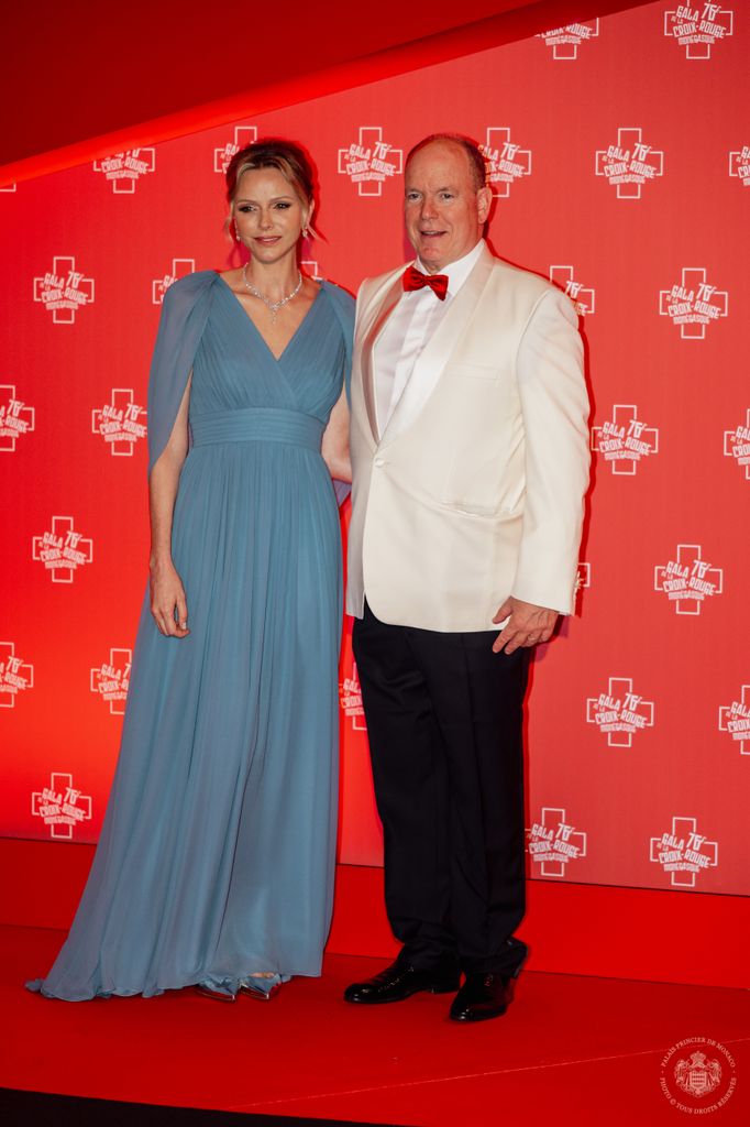 princess charlene in blue dress posed with albert