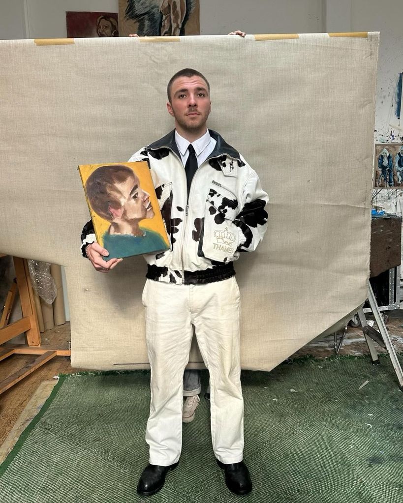 Rocco Ritchie poses with his artwork in Paris while modeling for Thames, shared on Instagram