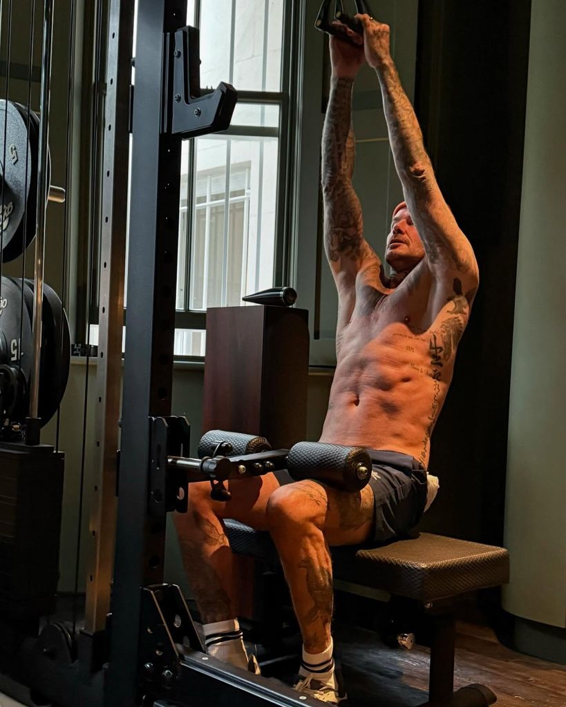 man performing exercise in gym