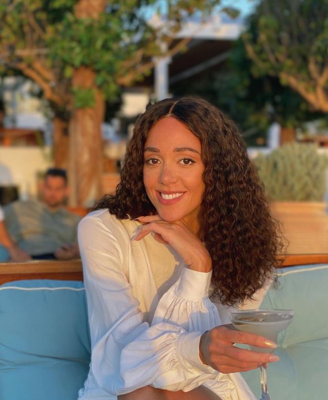 Katharina Johnson-Thompson sitting at an outside restaurant