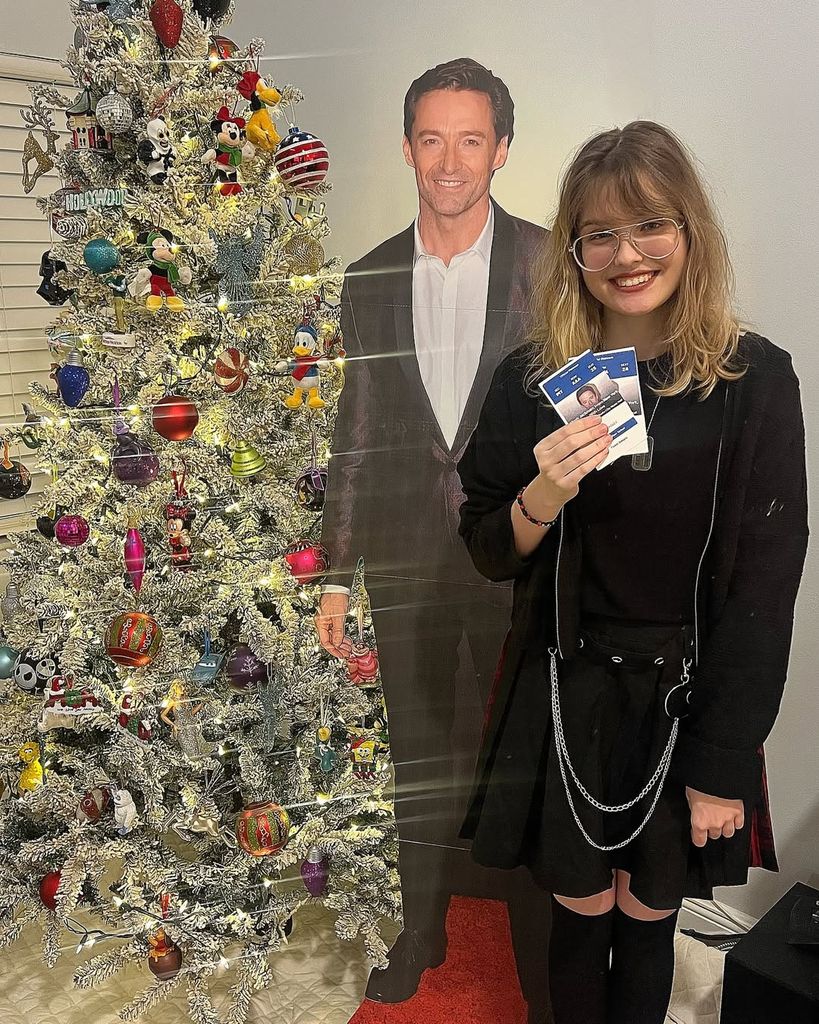 Dannielynn Birkhead poses beside her Hugh Jackman life-size cut-out for Christmas, shared on Instagram by dad Larry Birkhead