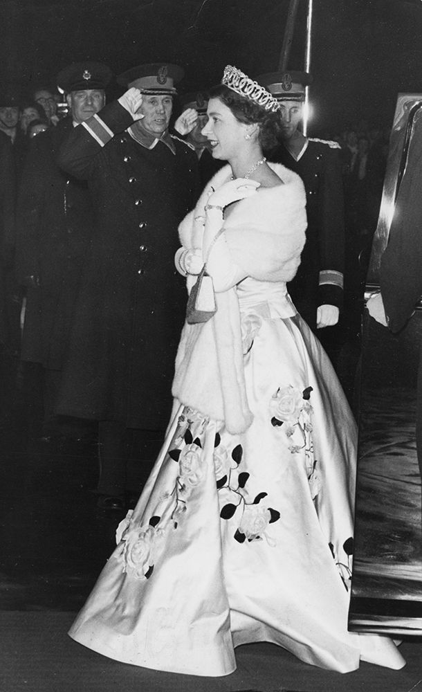 Queen Elizabeth II wearing a satin ballgown embroidered with roses 