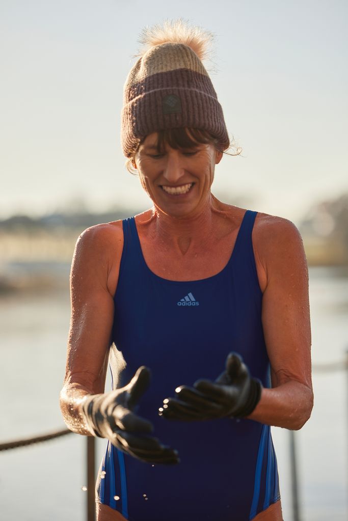 woman in a bobble hat and swimming costume 