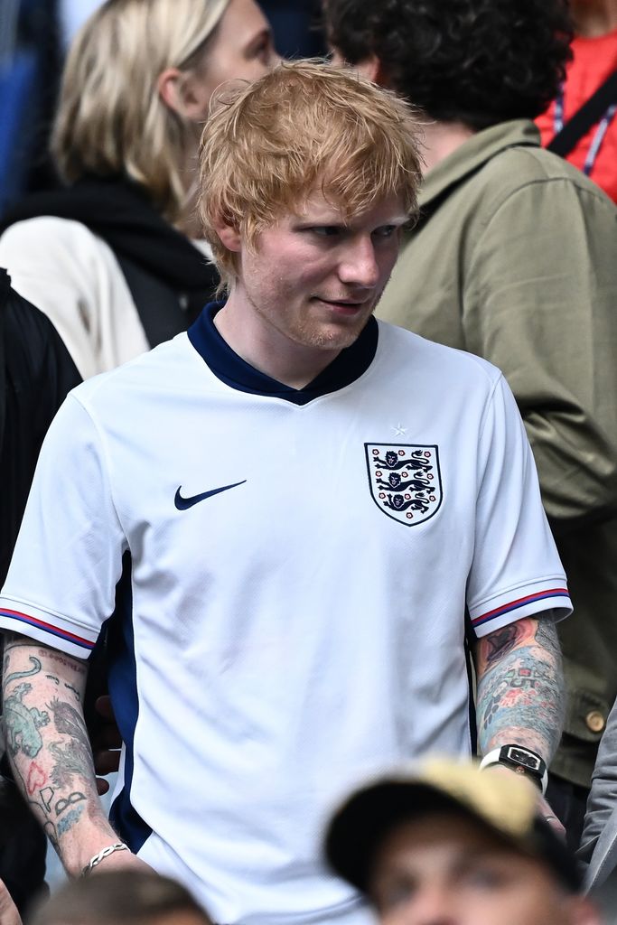 Ed Sheeran in a white England football shirt