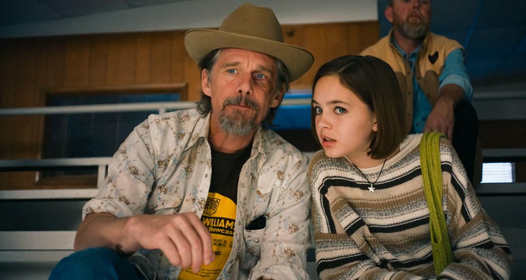 man and young girl sitting on benches
