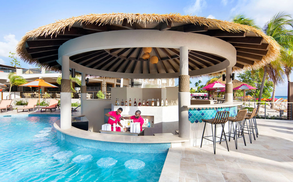 Take your pick of drinks and cocktails at the swim-up pool bar in the O2 Beach Club & Spa