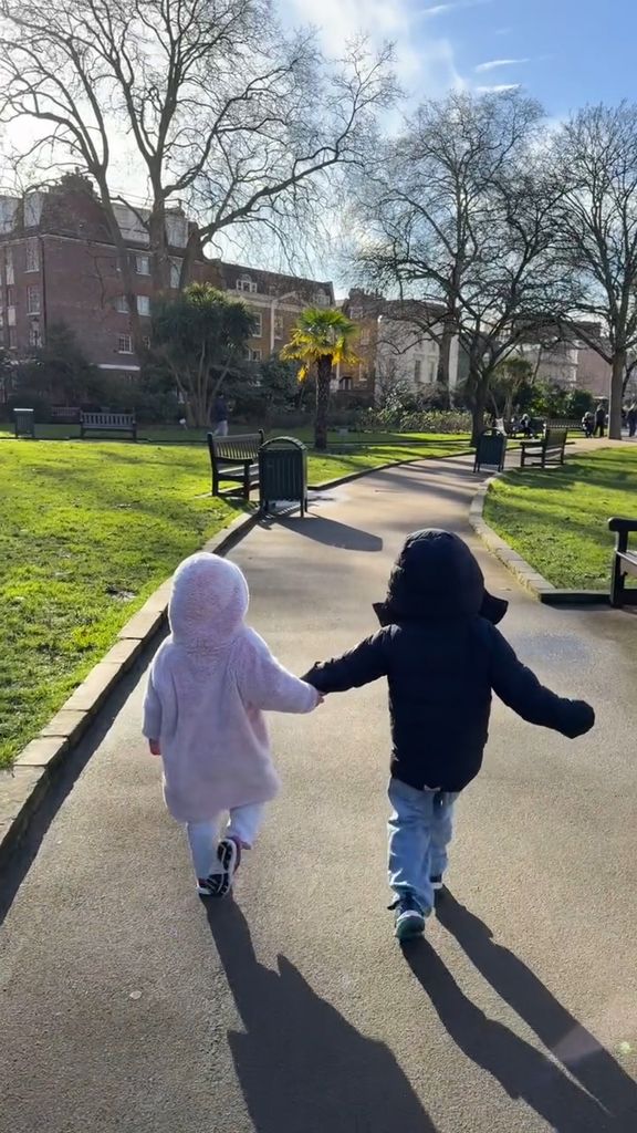 August Brooksbank walking in the park with his cousin Sienna