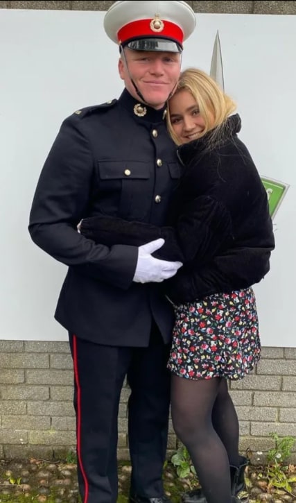 Tilly hugging Jack in military uniform