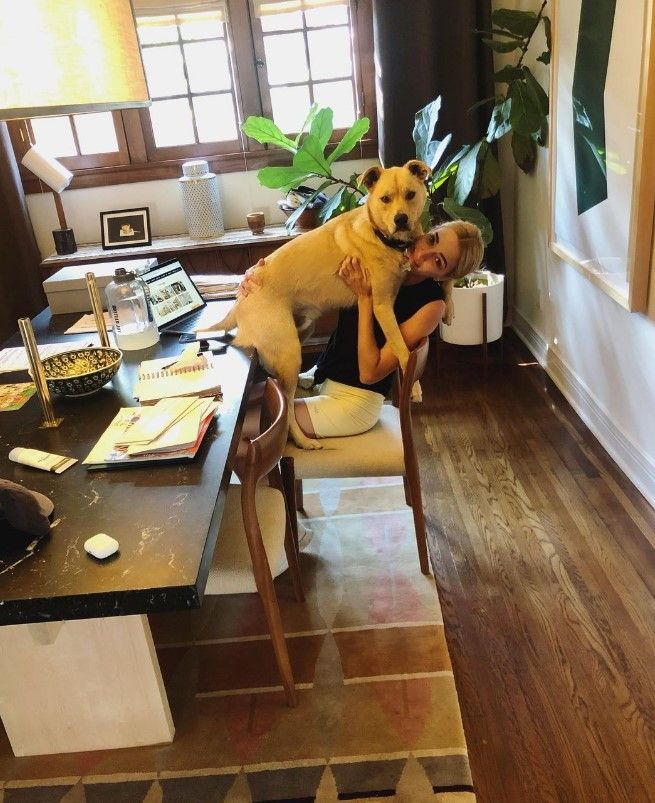 Brianne howey and dog in dining room 