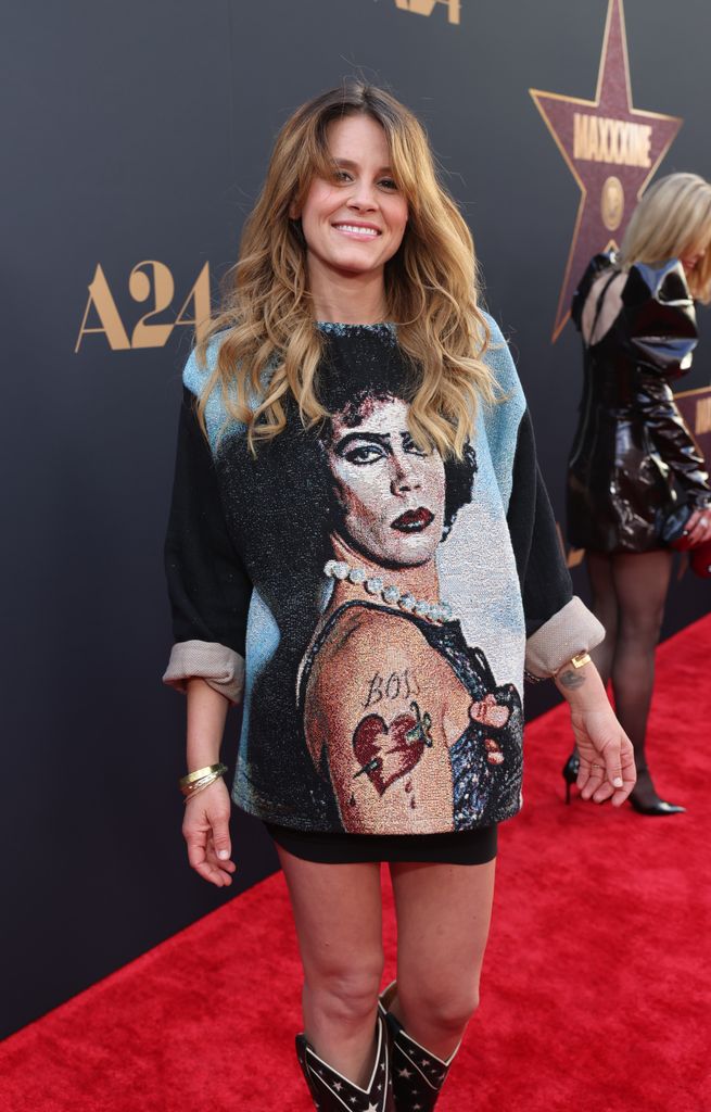 Sosie Bacon dons Tim Curry's face on a sweater at the Los Angeles Premiere of A24's "MAXXXINE" at TCL Chinese Theatre on June 24, 2024 in Hollywood, California