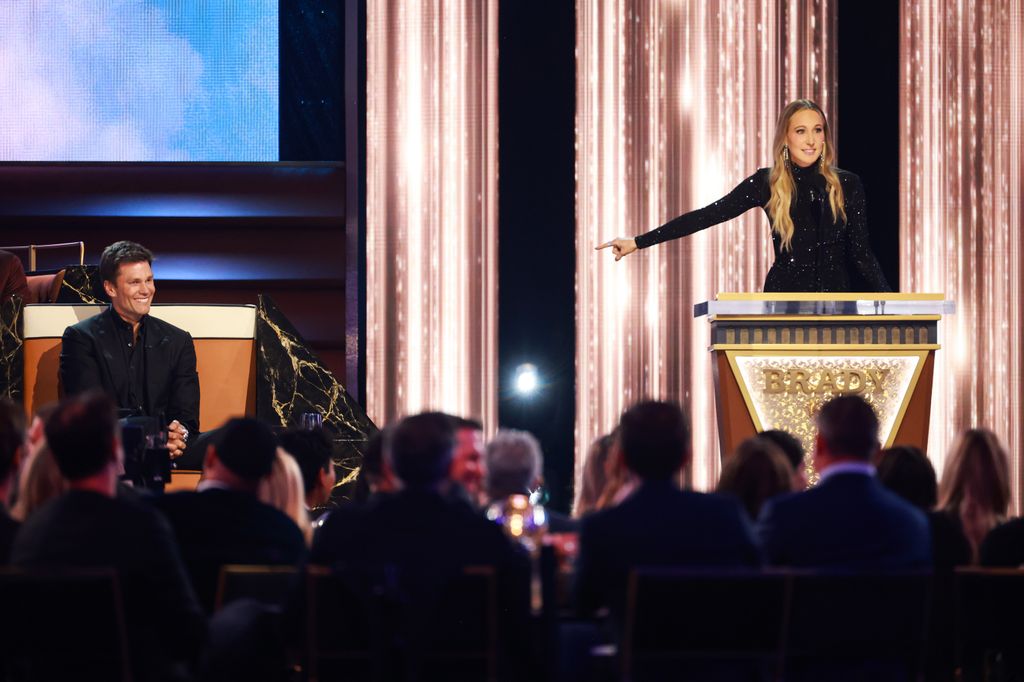 Tom Brady and Nikki Glaser speak onstage during G.R.O.A.T The Greatest Roast Of All Time: Tom Brady for the Netflix is a Joke Festival at The Kia Forum on May 05, 2024 in Inglewood, California.  (Photo by Matt Winkelmeyer/Getty Images for Netflix)