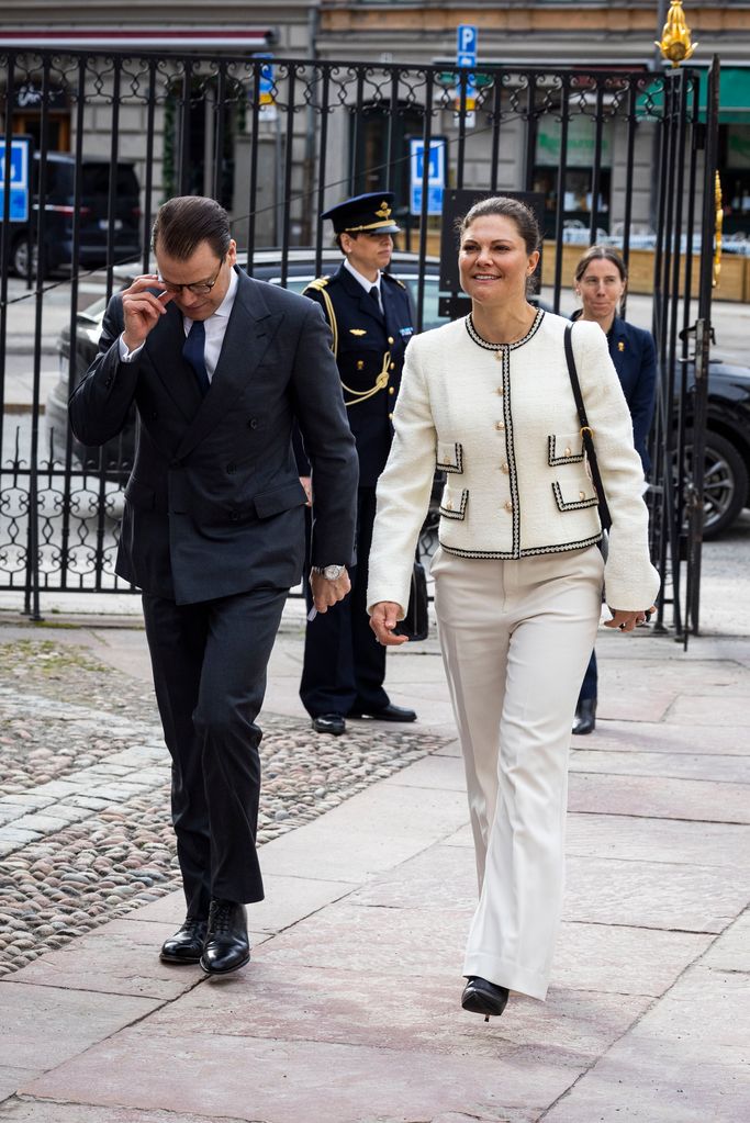 Crown Princess Victoria walking with Daniel in white trousers and jacket