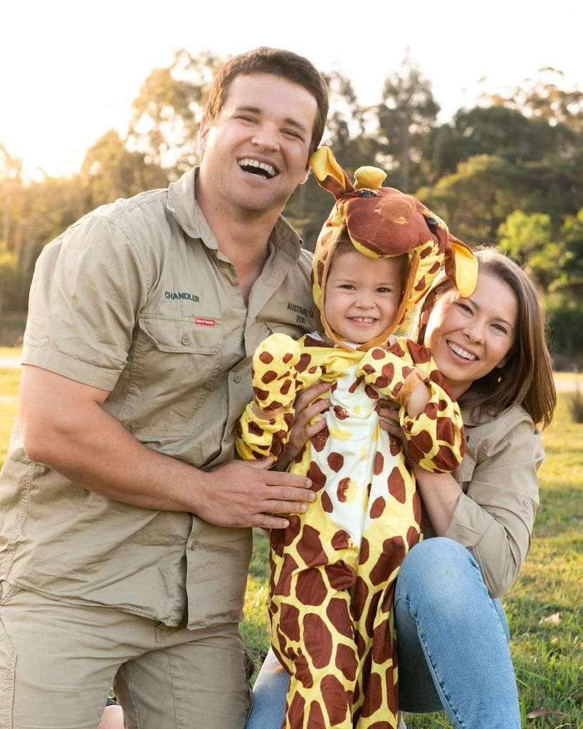 Bindi Irwin with her daughter dressed as a giraffe