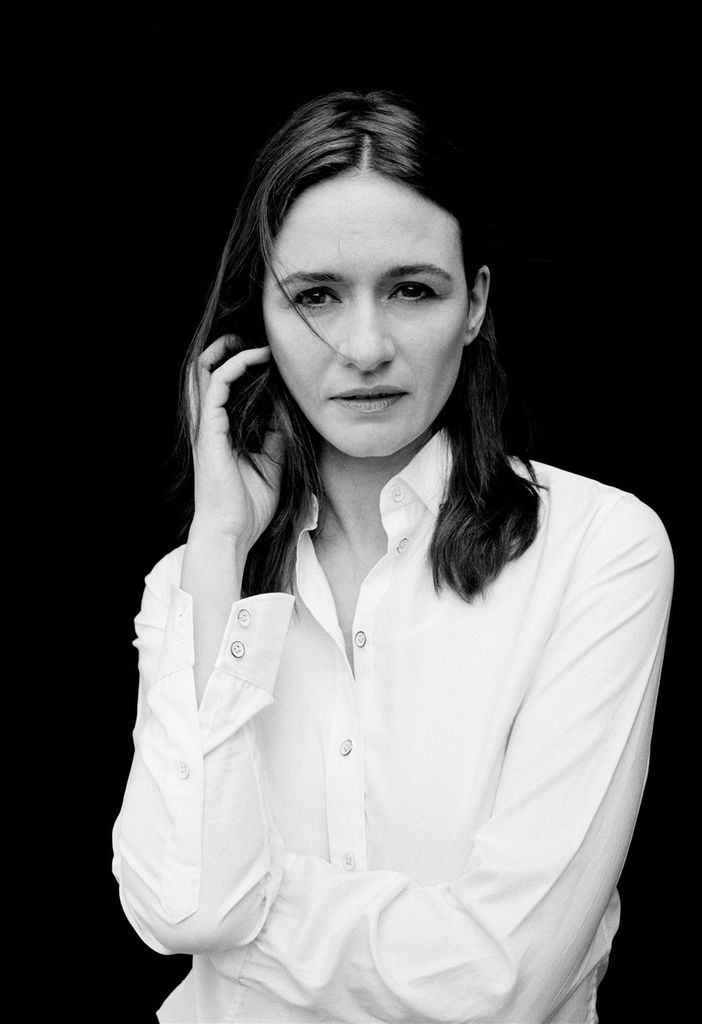 Black and white photo of woman in white shirt