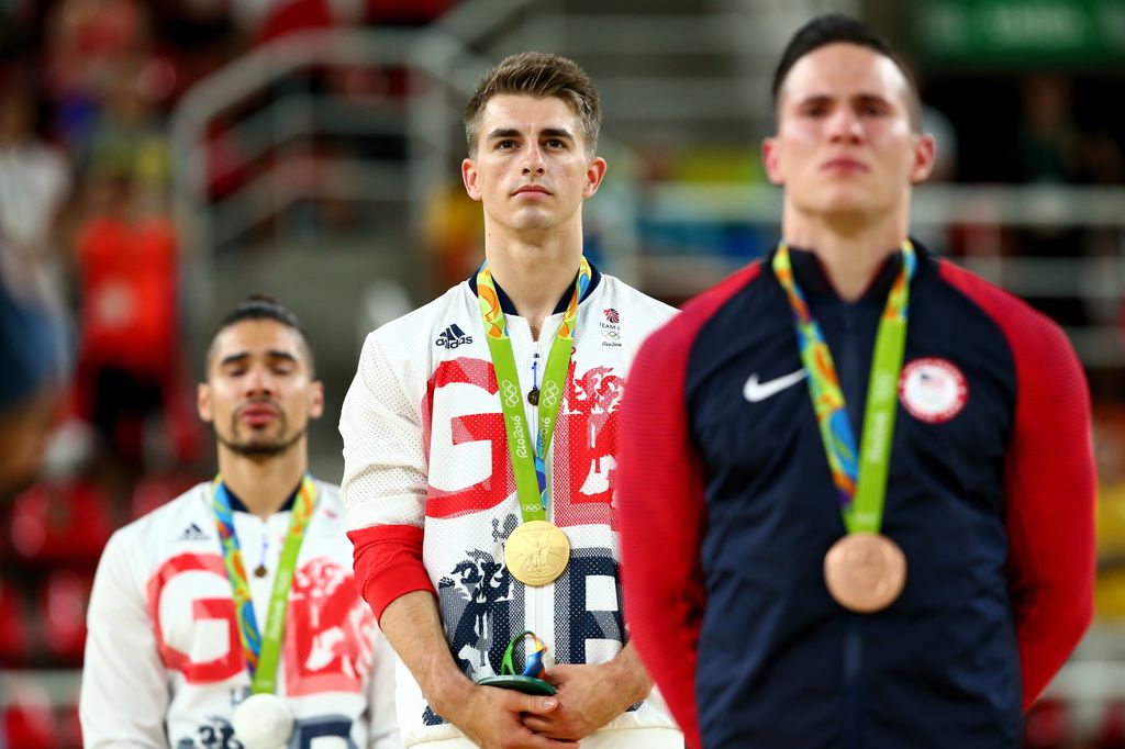 Max standing on the podium in Rio with his gold medal at the ceremony for Men's Pommel Horse 