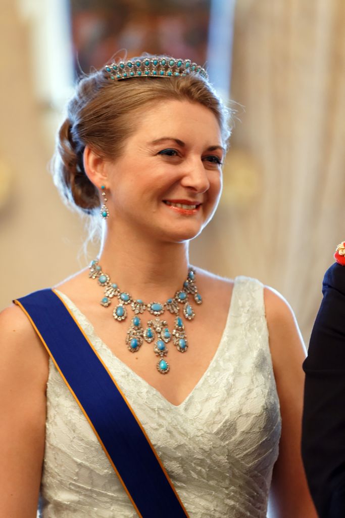 Princess Claire in a silver dress and necklace