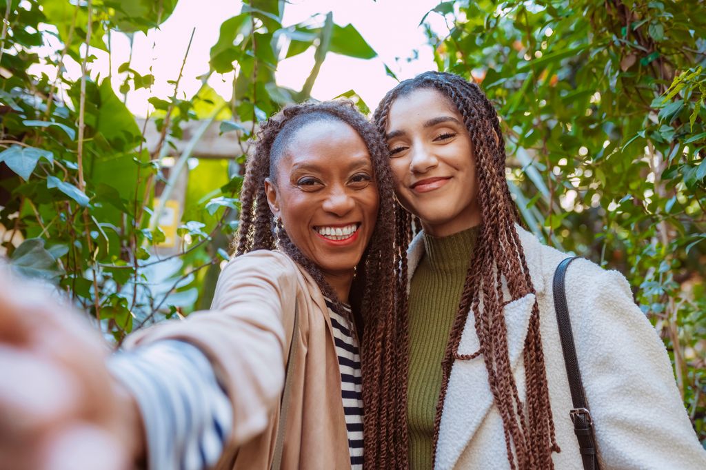 happy middle aged woman with younger woman daughter