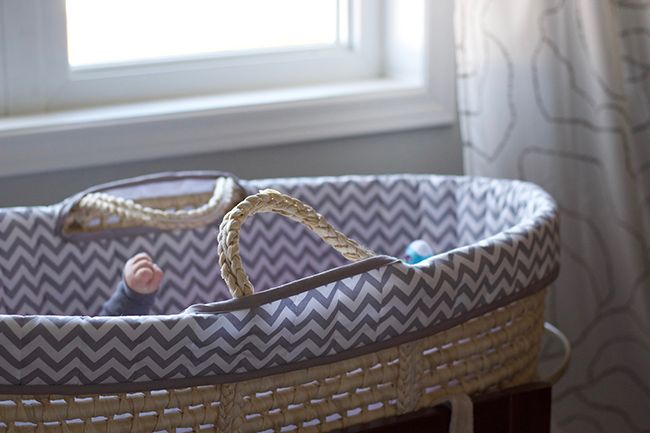 Baby sleeping in moses basket