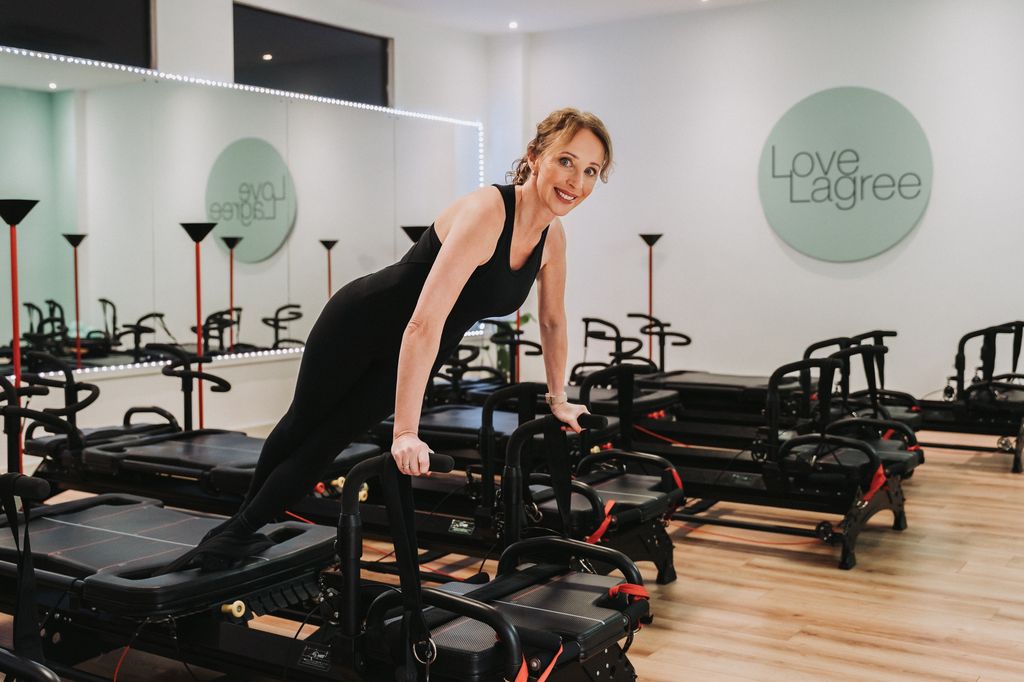 woman on a reformer Pilates machine 