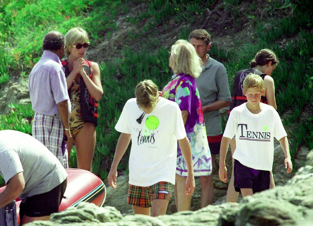 Mohamed Al Fayed (far left) and Diana, Princess Of Wales (right of Mohammed) are seen in St Tropez with her two young sons in 1997 