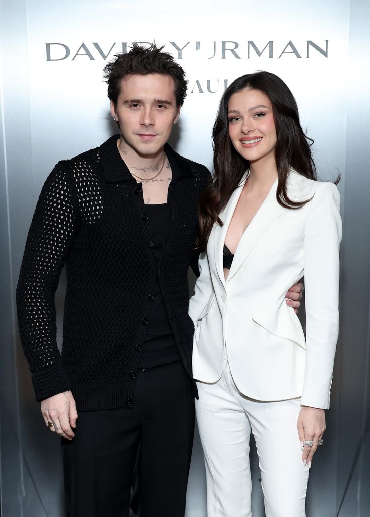 Brooklyn Beckham with his arm around Nicola Peltz