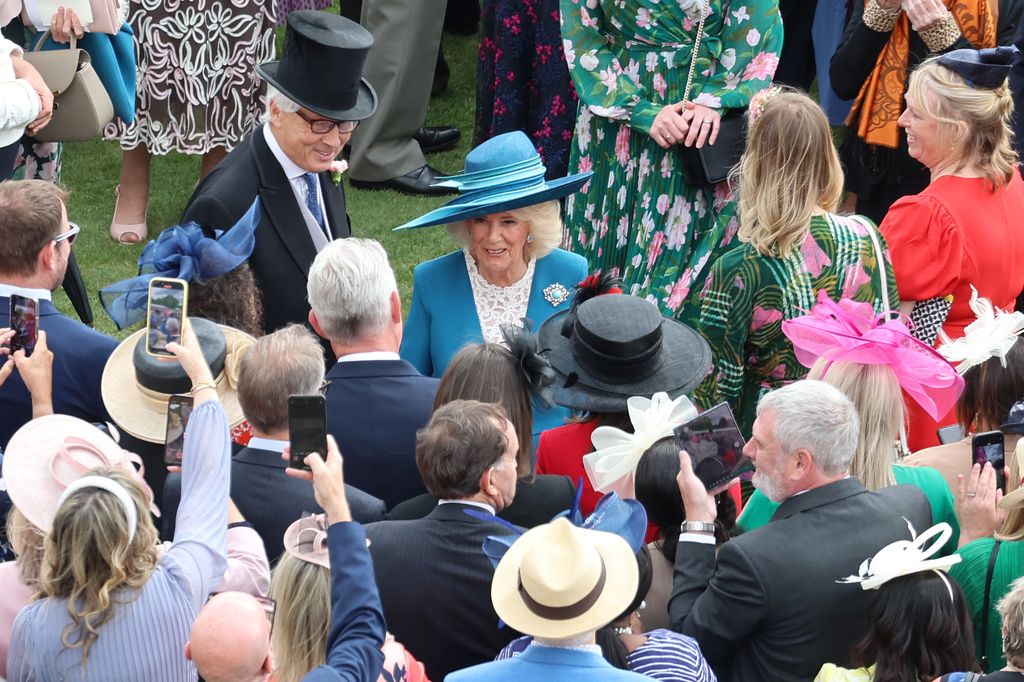 Queen Camilla meets guests