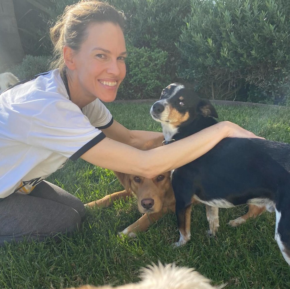 Hilary wank plays with her dog, Kai